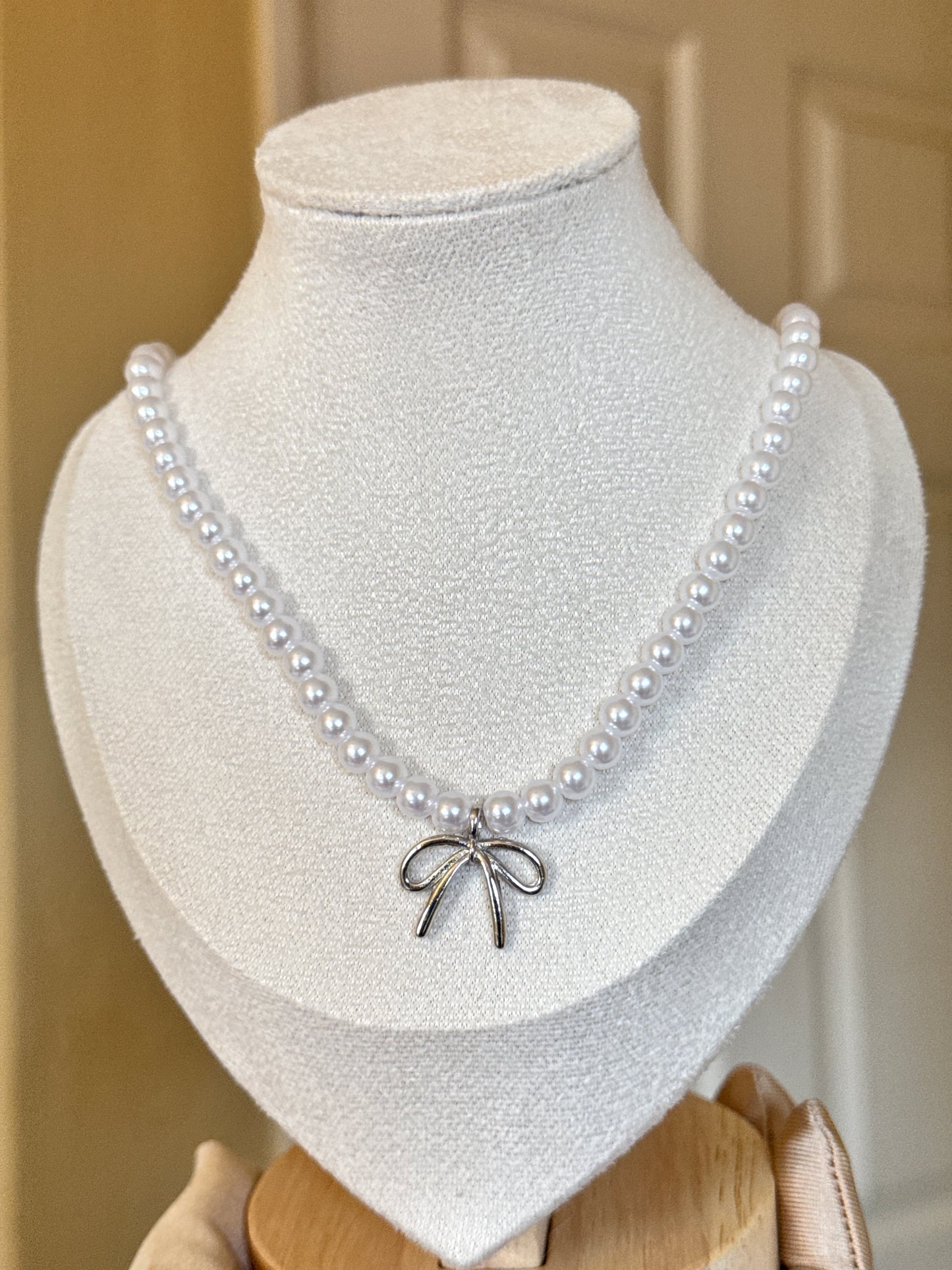 Silver Bow Pearl Necklace